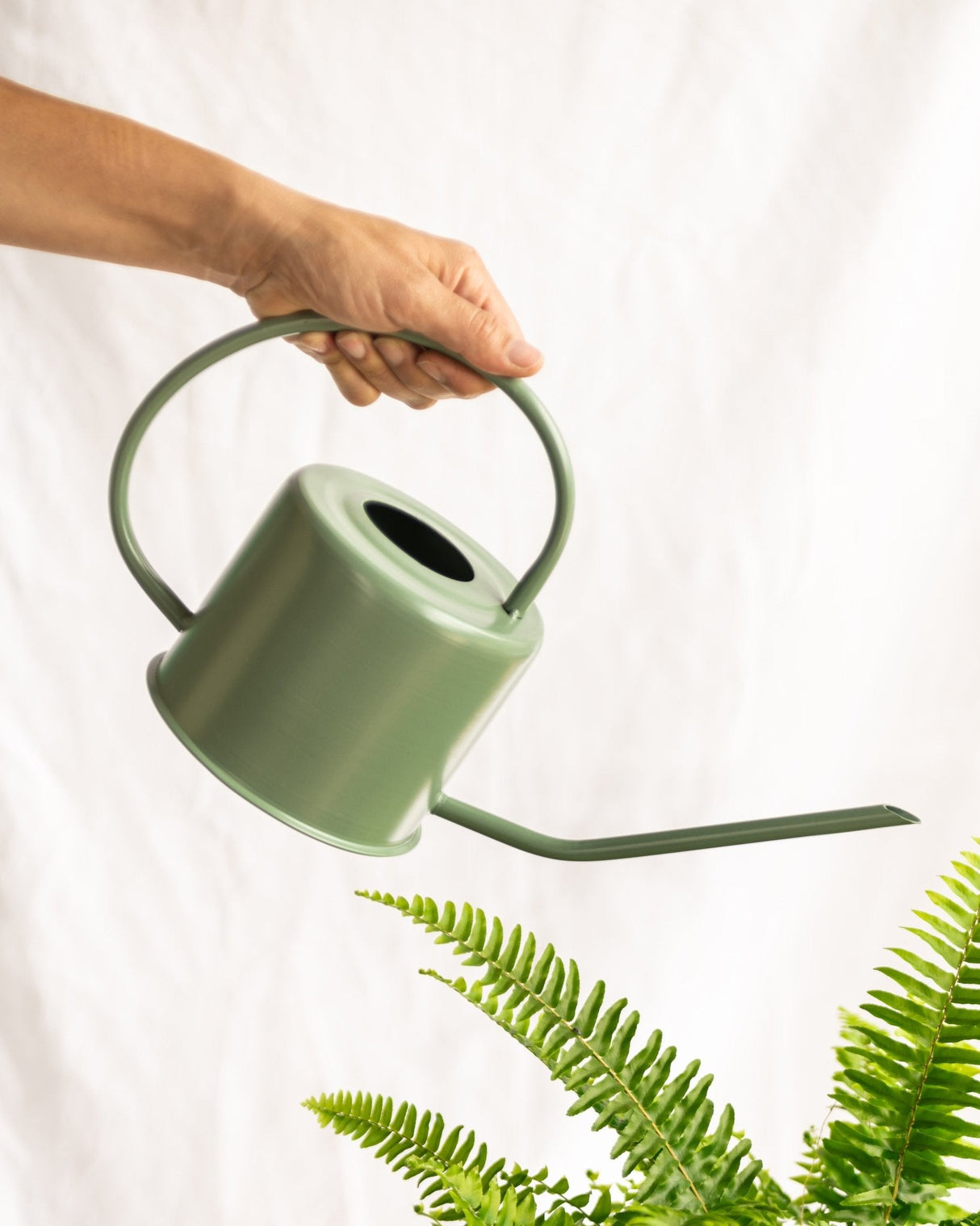 Green watering can